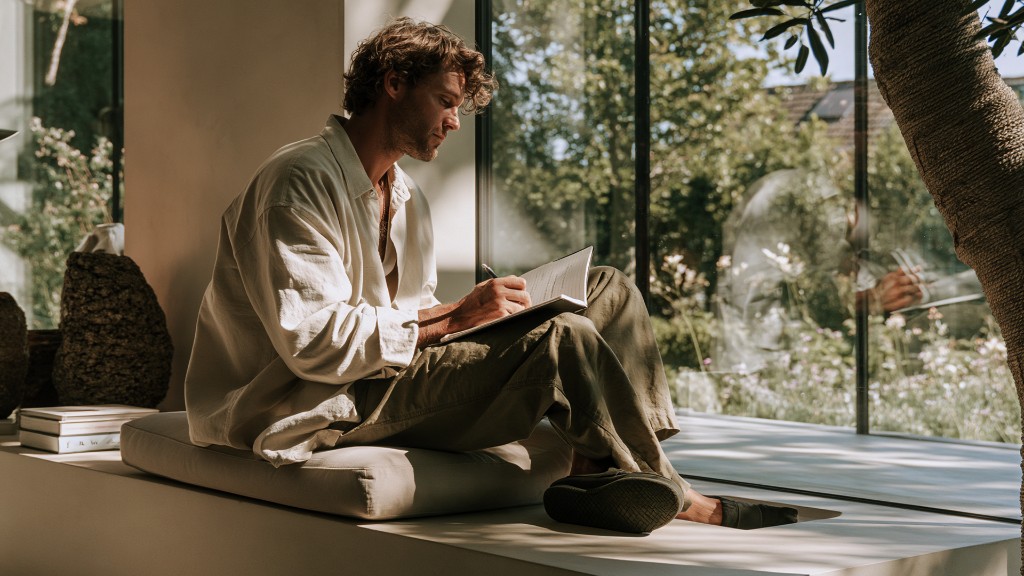Person writing in a journal as part of a daily nervous system regulation practice